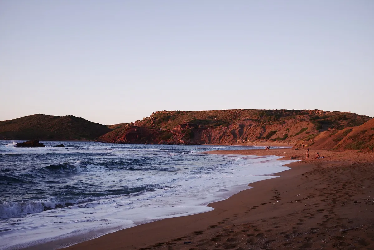Platges de Cavalleria beach inside the Menorca marine reserve, seen the way boat trips from Fornells see the north coast